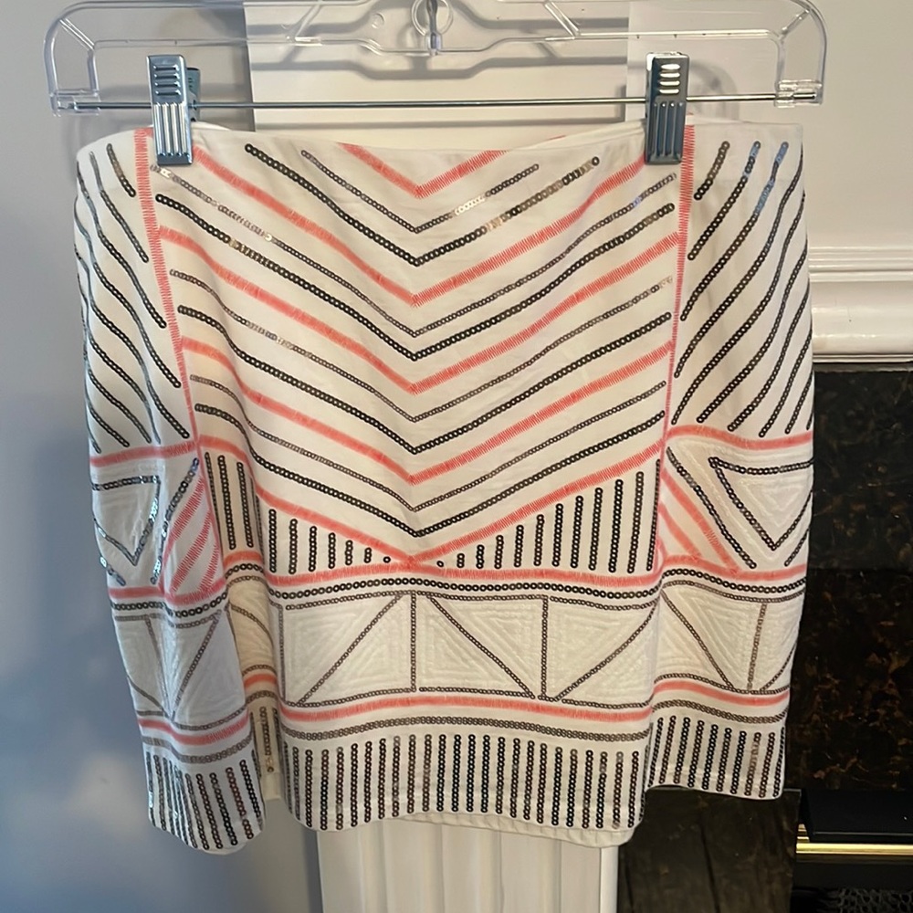 Express cream skirt with sequin accents. Size M